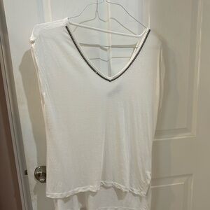 White V-neck with low back V-neck Jennifer Lopez, diamond studded large knit top